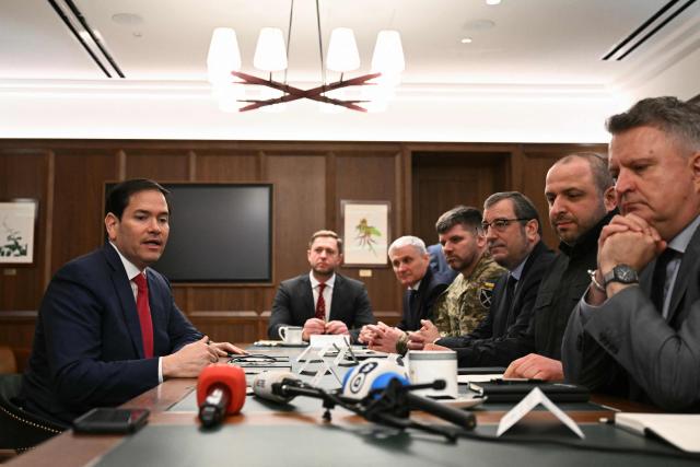US Secretary of State Marco Rubio (L) speaks during a meeting with Ukrainian officials headed by Rustem Umerov (2R) in Hallandale Beach, Florida on November 30, 2025. (Photo by CHANDAN KHANNA / AFP)
