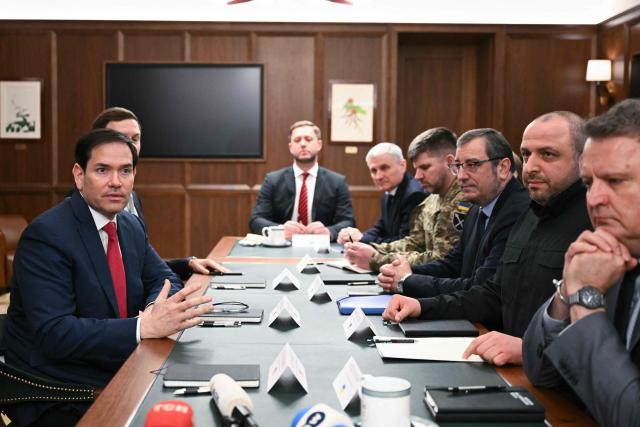 TOPSHOT - US Secretary of State Marco Rubio (L) speaks during a meeting with Ukrainian officials headed by Secretary of the National Security and Defense Council of Ukraine Rustem Umerov (2R)  in Hallandale Beach, Florida on November 30, 2025. (Photo by CHANDAN KHANNA / AFP)