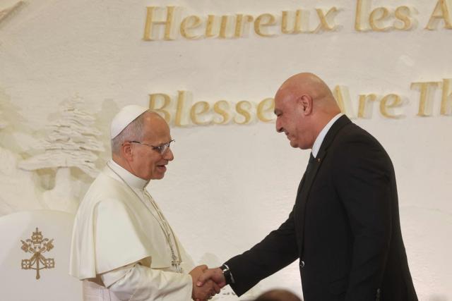 Pope Leo XIV (L) shakes hands with Lebanon's President Joseph Aoun during a meeting at the presidential palace in Baabda, east of the capital Beirut, on November 30, 2025. Pope Leo XIV arrived in Lebanon on November 30 with a message of peace for the crisis-hit nation, still reeling from a war between Israel and Hezbollah and the conflict's lingering aftereffects. (Photo by ANWAR AMRO / AFP)