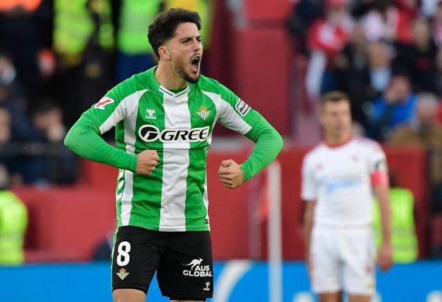 Real Betis' Spanish midfielder #08 Pablo Fornals celebrates scoring his team's first goal during the Spanish league football match between Sevilla FC and Real Betis at Ramon Sanchez Pizjuan Stadium in Seville on November 30, 2025. (Photo by CRISTINA QUICLER / AFP)