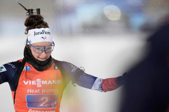 France's Lou Jeanmonnot crosses the finish line to win with her team the mixed relay event of the IBU Biathlon World Cup in Oestersund, Sweden on November 30, 2025. (Photo by Bjorn LARSSON ROSVALL / various sources / AFP) / Sweden OUT
