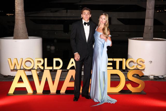 Sweden's world pole vault champion Armand Duplantis (L) poses with his partner Swedish model Desire Inglander (R) on the red carpet upon arrival for the World Athletics Awards 2025 in Monaco, on November 30, 2025. (Photo by Valery HACHE / AFP)