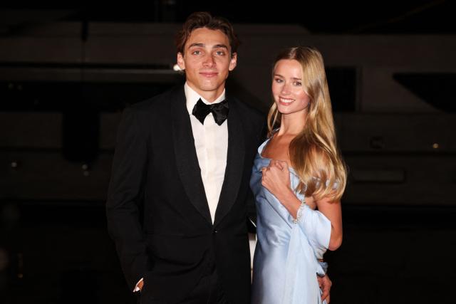 Sweden's world pole vault champion Armand Duplantis (L) poses with his partner Swedish model Desire Inglander (R) on the red carpet upon arrival for the World Athletics Awards 2025 in Monaco, on November 30, 2025. (Photo by Valery HACHE / AFP)
