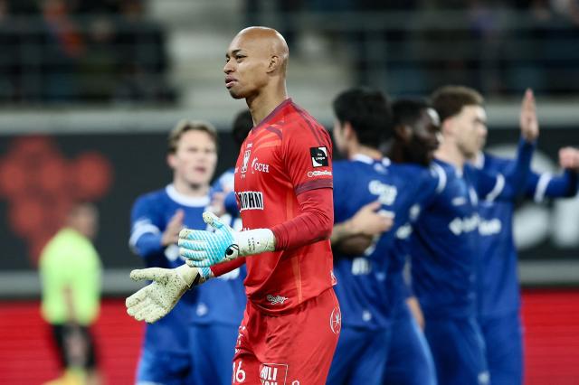 STVV's Japanese goalkeeper #16 Leo Kokubo reacts after the goal of KAA Gent's Ivoirian forward #07 Wilfried Kanga during the Belgian "Pro League" First Division football match between KAA Gent and Sint-Truidense V.V. at the Ghelamco Arena in Ghent on November 30, 2025. (Photo by BRUNO FAHY / Belga / AFP) / Belgium OUT