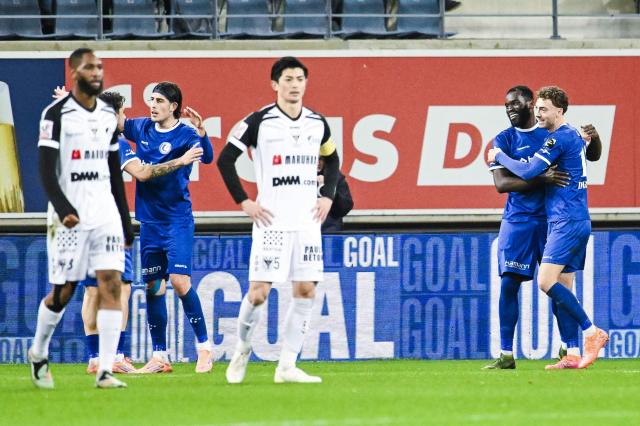 Gent's French forward Wilfried Kanga (2nd R) celebrates after scoring during the Belgian "Pro League" First Division football match between KAA Gent and Sint-Truidense V.V. at the Ghelamco Arena in Ghent on November 30, 2025. (Photo by Tom Goyvaerts / Belga / AFP) / Belgium OUT