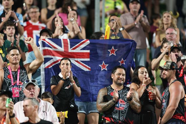 Fans cheer ahead of the HSBC World Rugby Sevens Series Women's final rugby match between Australia and New Zealand at the Sevens Stadium in Dubai on November 30, 2025. (Photo by FADEL SENNA / AFP)