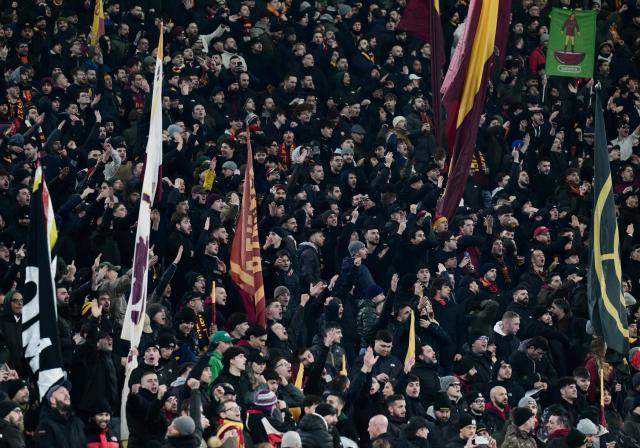 AS Roma's supporter hold flags prior the Italian Serie A football match between AS Roma and Napoli at the Olympic Stadium in Rome on November 30, 2025. (Photo by Tiziana FABI / AFP)