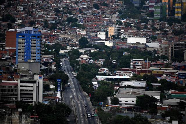 Aerial view of Maiquetia, La Guaira State, Venezuela, on November 30, 2025. US President Donald Trump sharply escalated his threats against Venezuela on Saturday with an ominous warning that the country's airspace should be considered "closed," raising fears of imminent military action. (Photo by Federico PARRA / AFP)