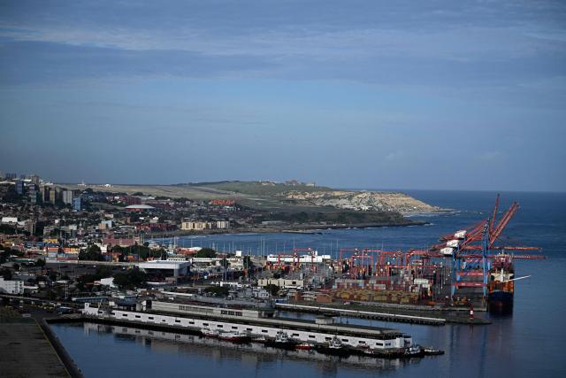 Aerial view of the port of La Guaira, Venezuela, on November 30, 2025. US President Donald Trump sharply escalated his threats against Venezuela on Saturday with an ominous warning that the country's airspace should be considered "closed," raising fears of imminent military action. (Photo by Federico PARRA / AFP)
