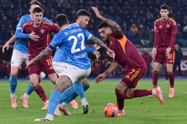 Roma's Italian midfielder #07 Lorenzo Pellegrini vies with Napoli's Italian defender #22 Giovanni Di Lorenzo during the Italian Serie A football match between AS Roma and Napoli at the Olympic Stadium in Rome on November 30, 2025. (Photo by Tiziana FABI / AFP)