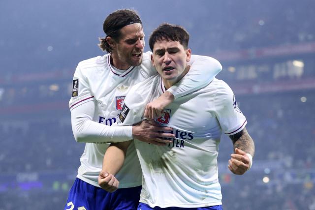 Lyon's Uruguayan forward #20 Martin Satriano (R) celebrates scoring his team's second goal during the French L1 football match between Olympique Lyonnais (OL) and FC Nantes at the Parc Olympique Lyonnais stadium in Decines-Charpieu, central-eastern France on November 30, 2025. (Photo by Alex MARTIN / AFP)