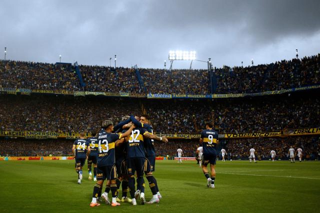 Boca Juniors' Ayrton Costa (C) celebrates with teammates after scoring a goal during the Argentine Professional Football League 2025 Clausura Tournament quarter-final match between Boca Juniors and Argentinos Juniors at the La Bombonera Stadium in Buenos Aires on November 30, 2025. (Photo by MARCOS BRINDICCI / AFP)