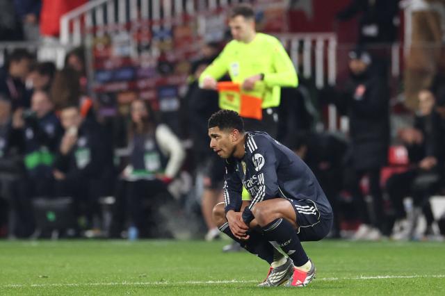 Real Madrid's English midfielder #05 Jude Bellingham reacts at the end of the Spanish league football match between Girona FC and Real Madrid CF at Montilivi Stadium in Girona on November 30, 2025. (Photo by Josep LAGO / AFP)