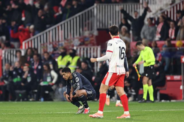 Real Madrid's English midfielder #05 Jude Bellingham reacts at the end of the Spanish league football match between Girona FC and Real Madrid CF at Montilivi Stadium in Girona on November 30, 2025. (Photo by Josep LAGO / AFP)