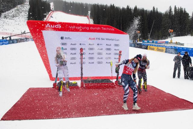 (L-R) German Lena Duerr, second place, Mikaela Shiffrin of the US, first place, and Albanian Lara Colturi, third place, celebrate in the podium of the Women's Slalom during the Stifel Copper Cup 2025 at Copper Mountain, part of the FIS Alpine Ski World Cup, in Copper Mountain, Colorado on November 30, 2025. (Photo by Jason Connolly / AFP)