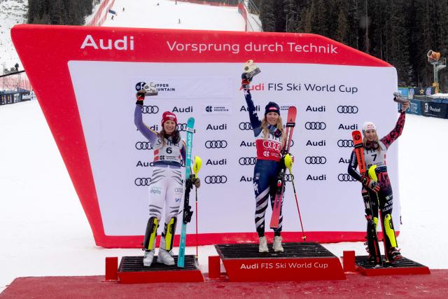 (L-R) German Lena Duerr, second place, Mikaela Shiffrin of the US, first place, and Albanian Lara Colturi, third place, pose in the podium of the Women's Slalom during the Stifel Copper Cup 2025 at Copper Mountain, part of the FIS Alpine Ski World Cup, in Copper Mountain, Colorado on November 30, 2025. (Photo by Jason Connolly / AFP)