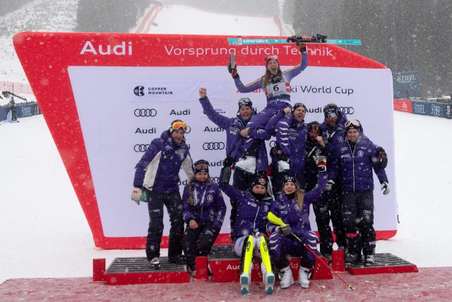 German Lena Duerr (C) celebrates with members of team Germany after finishing in second place in the Women's Slalom during the Stifel Copper Cup 2025 at Copper Mountain, part of the FIS Alpine Ski World Cup, in Copper Mountain, Colorado on November 30, 2025. (Photo by Jason Connolly / AFP)