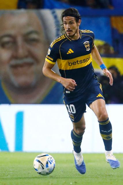 Boca Juniors' Uruguayan forward #10 Edinson Cavani runs with the ball during the Argentine Professional Football League 2025 Clausura Tournament quarter-final match between Boca Juniors and Argentinos Juniors at La Bombonera Stadium in Buenos Aires on November 30, 2025. (Photo by MARCOS BRINDICCI / AFP)