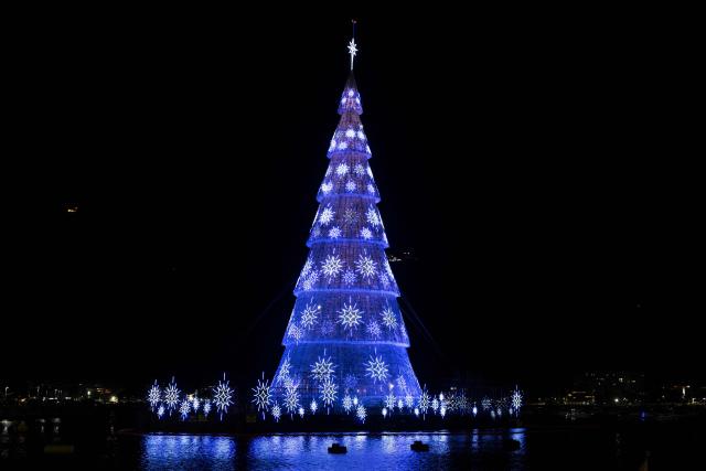 A floating Christmas tree is pictured at Botafogo waterfront in Rio de Janeiro, Brazil on November 30, 2025. (Photo by Pablo PORCIUNCULA / AFP)