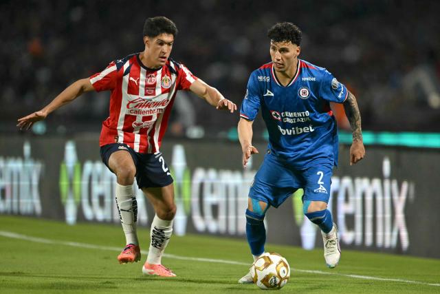 Guadalajara's defender #21 Jose Castillo and Cruz Azul's defender #02 Jorge Sanchez fight for the ball during the Liga MX Apertura quarter-final second leg football match between Cruz Azul and Guadalajara at the Olimpico Universitario Stadium in Mexico City on November 30, 2025. (Photo by YURI CORTEZ / AFP)