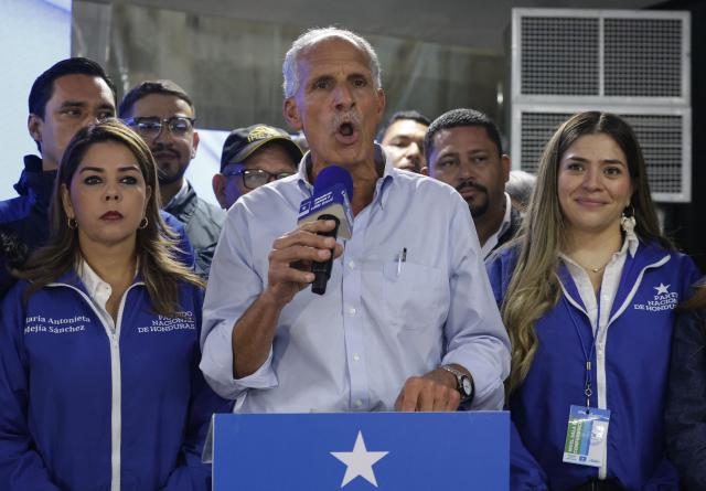 Honduran presidential candidate of the National Party, Nasry Asfura, delivers a speech as he waits for the results of the presidential election in Tegucigalpa on November 30, 2025. (Photo by Lucas AGUAYO / AFP)