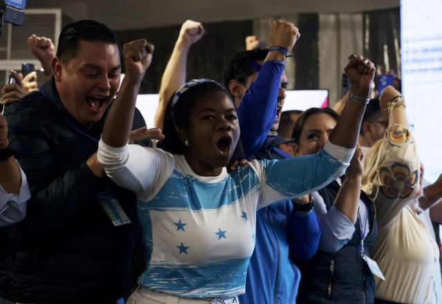 Supporters of Honduran presidential candidate of the National Party, Nasry Asfura, celebrate after the first results of the presidential election in Tegucigalpa on November 30, 2025. (Photo by Lucas AGUAYO / AFP)