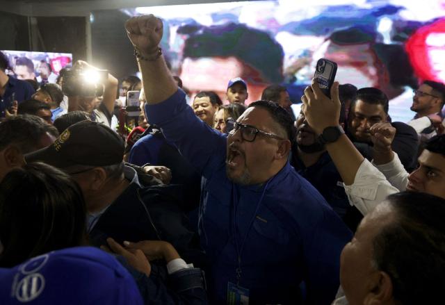 A supporter of Honduran presidential candidate of the National Party, Nasry Asfura, celebrate after the first results of the presidential election in Tegucigalpa on November 30, 2025. (Photo by Lucas AGUAYO / AFP)