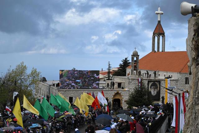 Crowds gather for the arrival of Pope Leo XIV to the tomb of Saint Charbel Makhlouf or Mar Charbel in Arabic, a Lebanese Maronite monk and priest, at the Saint Maron monastery in the mountainous village of Annaya, north of the capital Beirut on December 1, 2025. Pope Leo XIV is set to urge peace and unity on his second day in Lebanon on December 1, 2025, bringing a message of hope to young people whose faith in their crisis-hit country has dwindled. (Photo by JOSEPH EID / AFP)