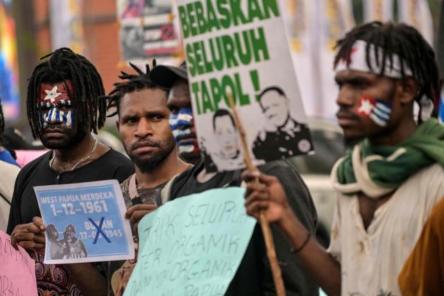 Papuan students take part in a protest calling for the independence of Papua province in Surabaya on December 1, 2025, to coincide with the anniversary of the Free Papua Movement. (Photo by JUNI KRISWANTO / AFP)