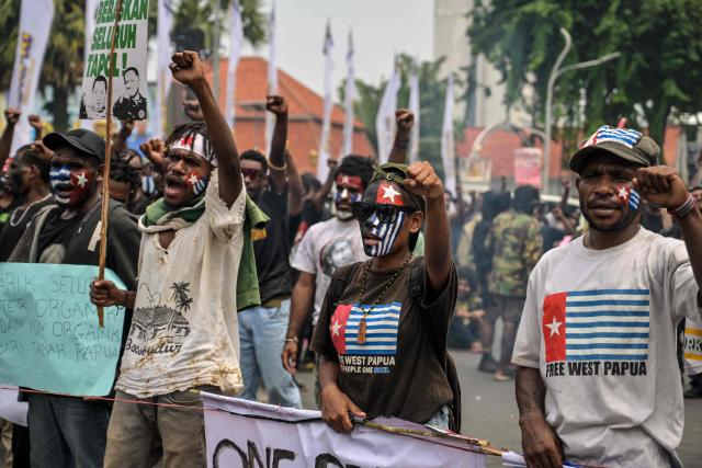 Papuan students take part in a protest calling for the independence of Papua province in Surabaya on December 1, 2025, to coincide with the anniversary of the Free Papua Movement. (Photo by JUNI KRISWANTO / AFP)