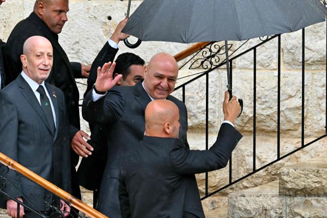 Lebenon's President Joseph Aoun waves before a visit of Pope Leo XIV to the tomb of Saint Charbel Makhlouf at the Saint Maron monastery in the mountainous village of Annaya on December 1, 2025.  (Photo by Andreas SOLARO / AFP)