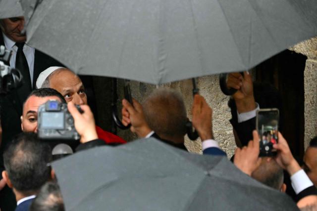 Pope Leo XIV arrives for a visit to the tomb of Saint Charbel Makhlouf at the Saint Maron monastery in the mountainous village of Annaya on December 1, 2025.  (Photo by Andreas SOLARO / AFP)