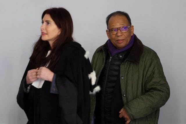 Defendant Lai Kamara arrives at Nanterre courthouse, on December 1, 2025, for the opening hearing in the trial of seven people before the Criminal Court, for attempted fraud and corruption against oil giant TotalEnergies. The defendants are suspected of having, to varying degrees, worked to establish an arbitration tribunal in 2009, at the initiative of the Russian regions of Saratov and Volgograd (in the south-west of the country) and the Russian company Interneft. Businessman Andrй Guelfi, known as “Dйdй la sardine,” is suspected of having played a leading role in setting up this arbitration, which has been denounced by TotalEnergies. (Photo by Thomas SAMSON / AFP)