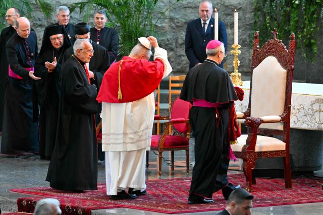 Pope Leo XIV arrives for a meeting with bishpops, priests consacrated persons and personal workers at the shrine of Our Lady of Lebanon in Harissa, northeast of the capital Beirut, on December 1, 2025.  (Photo by Andreas SOLARO / AFP)