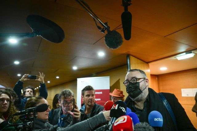 Defendant Gilles Rossary-Lenglet makes a statement as he leaves the trial of the sex-tape blackmail case at the courthouse after the verdict in Lyon on December 1 2025. Mayor of Saint Etienne Gaël Perdriau announced his intention to appeal against his conviction today to five years in prison, of which four are custodial, in the case known as the sextape blackmail affair after Lyon court deliberated in the trial over the so-called "sex-tape" case of Saint-Etienne's town hall. At the heart of the trial is the mayor of the town, Gael Perdriau, 53, accused of ordering a video of his former deputy Gilles Artigues with a male prostitute, and tried alongside former associates for blackmail, criminal conspiracy and embezzlement of public funds. (Photo by OLIVIER CHASSIGNOLE / AFP)