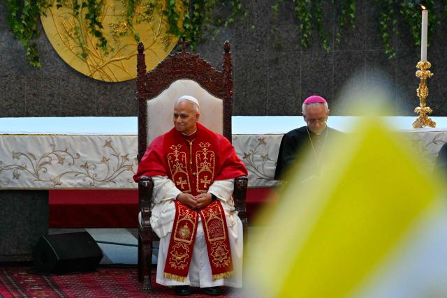 Pope Leo XIV attends a meeting with bishpops, priests consacrated persons and personal workers at the shrine of Our Lady of Lebanon in Harissa, northeast of the capital Beirut, on December 1, 2025.  (Photo by Andreas SOLARO / AFP)