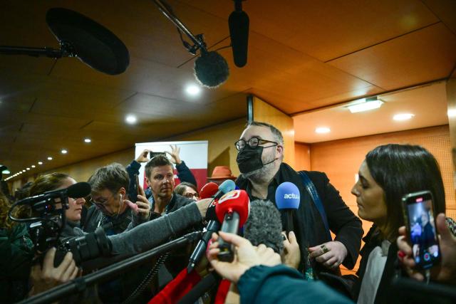 Defendant Gilles Rossary-Lenglet makes a statement as he leaves the trial of the sex-tape blackmail case at the courthouse after the verdict in Lyon on December 1 2025. Mayor of Saint Etienne Gaël Perdriau announced his intention to appeal against his conviction today to five years in prison, of which four are custodial, in the case known as the sextape blackmail affair after Lyon court deliberated in the trial over the so-called "sex-tape" case of Saint-Etienne's town hall. At the heart of the trial is the mayor of the town, Gael Perdriau, 53, accused of ordering a video of his former deputy Gilles Artigues with a male prostitute, and tried alongside former associates for blackmail, criminal conspiracy and embezzlement of public funds. (Photo by OLIVIER CHASSIGNOLE / AFP)