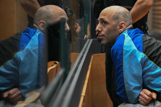 (FILES) Cedric Jubillar, accused of causing the disappearance of his wife Delphine, reacts as he sits in the dock in the courtroom of the Tarn Assize Courthouse in Albi, southwestern France, on September 22, 2025, on the opening day of his trial. Cédric Jubillar was stripped of his parental authority over his two children on December 1, 2025 in Albi, following his sentencing to thirty years of criminal imprisonment for the murder of his wife Delphine, according to Laurent de Caunes, lawyer for the civil parties. (Photo by Lionel BONAVENTURE / AFP)