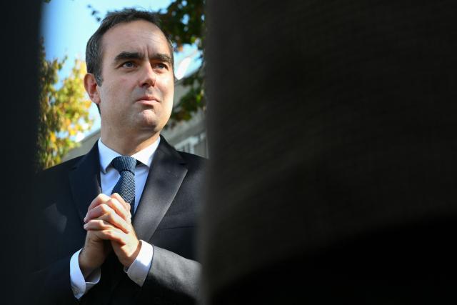 (FILES) France's Prime Minister Sebastien Lecornu speaks to journalists after a visit to a police station in L'Hay-les-Roses, on the southern outskirts of Paris on October 11, 2025. Lecornu began a crucial meeting with the socialists on December 1, 2025, key interlocutors in his quest for a compromise on budgets, including the Social Security budget returning to the Assembly starting on December 2, 2025. (Photo by Martin LELIEVRE / POOL / AFP)