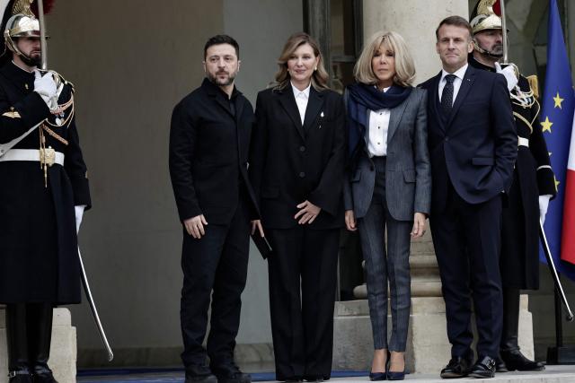 Ukrainian President Volodymyr Zelensky (L) and his wife Olena Zelenska (2ndL) pose with France’s President Emmanuel Macron (R) and his wife Brigitte Macron after a meeting at the Elysee palace in Paris, on December 1, 2025. Ukrainian President Volodymyr Zelensky meets French counterpart Emmanuel Macron, seeking to shore up European support as US President expressed optimism of a deal to end Russia's war in Ukraine. (Photo by STEPHANE DE SAKUTIN / AFP)