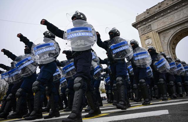 Romanian Gendarmes march during a military parade marking the National Day of Romania in Bucharest December 1, 2025. (Photo by Daniel MIHAILESCU / AFP)