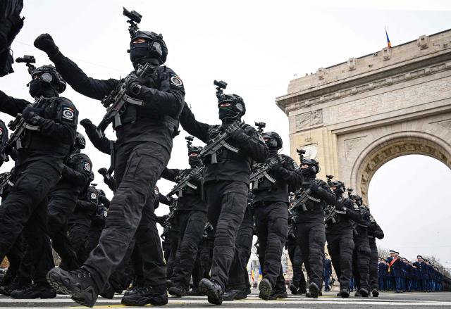 Romanian Secret Service (SRI) forces march during a military parade marking the National Day of Romania in Bucharest December 1, 2025. (Photo by Daniel MIHAILESCU / AFP)