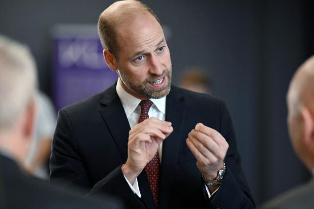 Britain's Prince William, Prince of Wales, talks to employees during a visit at the semiconductor manufacturer SPTS, a division of KLA, in the city of Newport, Wales, on December 1, 2025. (Photo by Matthew Horwood / POOL / AFP)