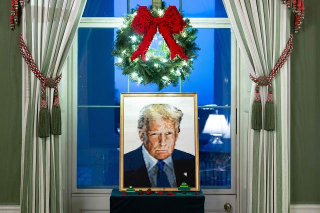 A portrait of US President Donald Trump made out of Legos is seen as part of Christmas decorations in the Green Room of the White House in Washington, DC, December 1, 2025, during a Christmas decoration media tour. (Photo by SAUL LOEB / AFP)