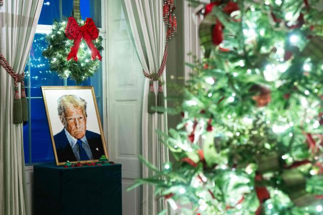 A portrait of US President Donald Trump made out of Legos is seen as part of Christmas decorations in the Green Room of the White House in Washington, DC, December 1, 2025, during a Christmas decoration media tour. (Photo by SAUL LOEB / AFP)
