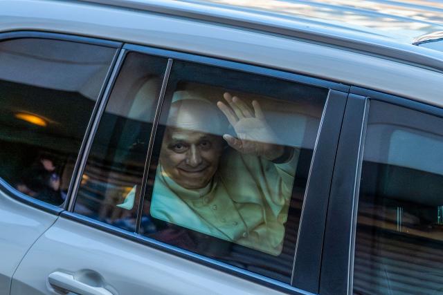 Pope Leo XIV waves at cheering crowds as his motorcade passes through Jounieh, north of Beirut, on December 1, 2025. Leo prayed for peace in Lebanon and the region on December 1 on day two of his trip to the multi-confessional country, with joyful Lebanese welcoming the pontiff at two famous pilgrimage sites. (Photo by Jewel SAMAD / AFP)