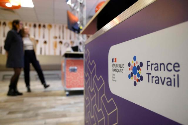 (FILES) (FILES) This photograph shows a logo of France Travail at the French national employment agency France Travail in Paris on February 4, 2025. The personal data of around 1.6 million young people monitored by local missions to help them find employment “may be disclosed” following a cyberattack, France Travail and the National Union of Local Missions (UNML) announced on December 1, 2025. (Photo by Ludovic MARIN / AFP)