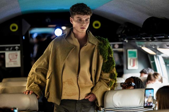 A model presents a creation on a TGV train as part of the "Circular Fashion Week" event on its way from Paris to Lille, on December 1, 2025. Giving visibility to circular fashion players: that is the goal of the first “Circular Fashion Week,” held from the December 1 to 7 in Lille's metropolitan area, with fashion shows, workshops, a professional forum, and a “committed” fashion market. To kick off this week of circular fashion, the first fashion show on a moving train was organised on a Paris-Lille TGV speed train. (Photo by Sameer Al-DOUMY / AFP)