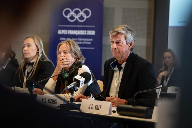 Pierre-Olivier Beckers Vieujant (R), head of the IOC Coordination Commission for the 2030 Winter Olympics in France listen to the members of the Olympic and Paralympic Games Organizing Committee during the coordination committee meeting for the 2030 Winter Olympics in the French Alps in Val d'Isère, central eastern France, on December 1, 2025. (Photo by ARNAUD FINISTRE / AFP)