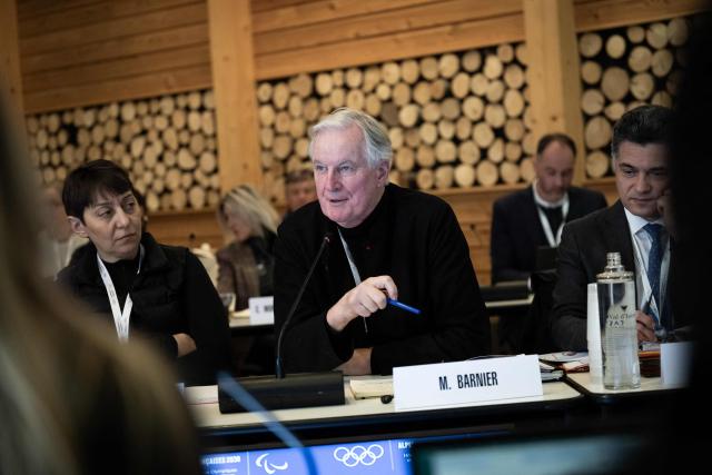 Michel Barnier, former French Prime Minister, speaks during the coordination committee meeting for the 2030 Winter Olympics in the French Alps in Val d'Isère, central eastern France, on December 1, 2025. (Photo by ARNAUD FINISTRE / AFP)